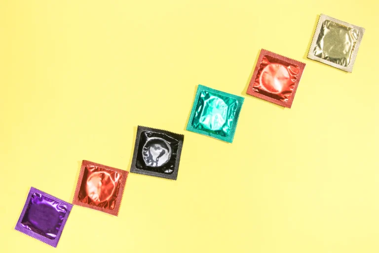 Flat lay of different condom types and sizes, a guide to choosing a condom in Malaysia